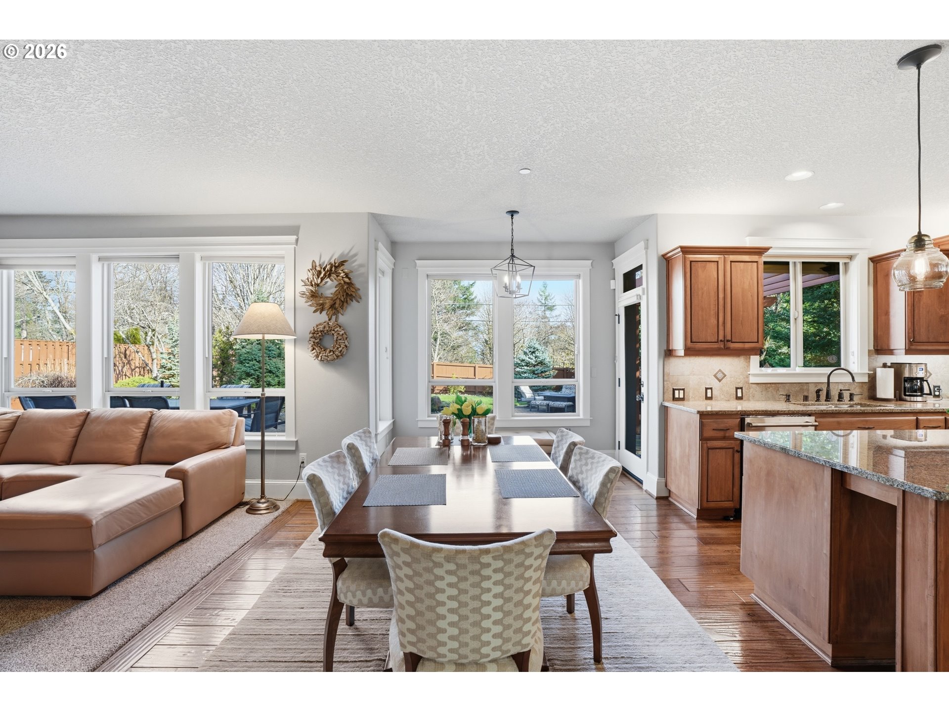 2552 Northwest 12th Circle Camas, WA 98607 - Photo 13 of 46 a dining room with furniture wooden floor and a kitchen view