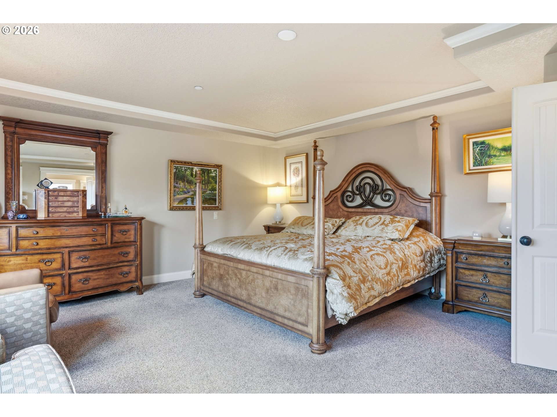 2552 Northwest 12th Circle Camas, WA 98607 - Photo 24 of 46 a bedroom with a bed and dresser with mirror