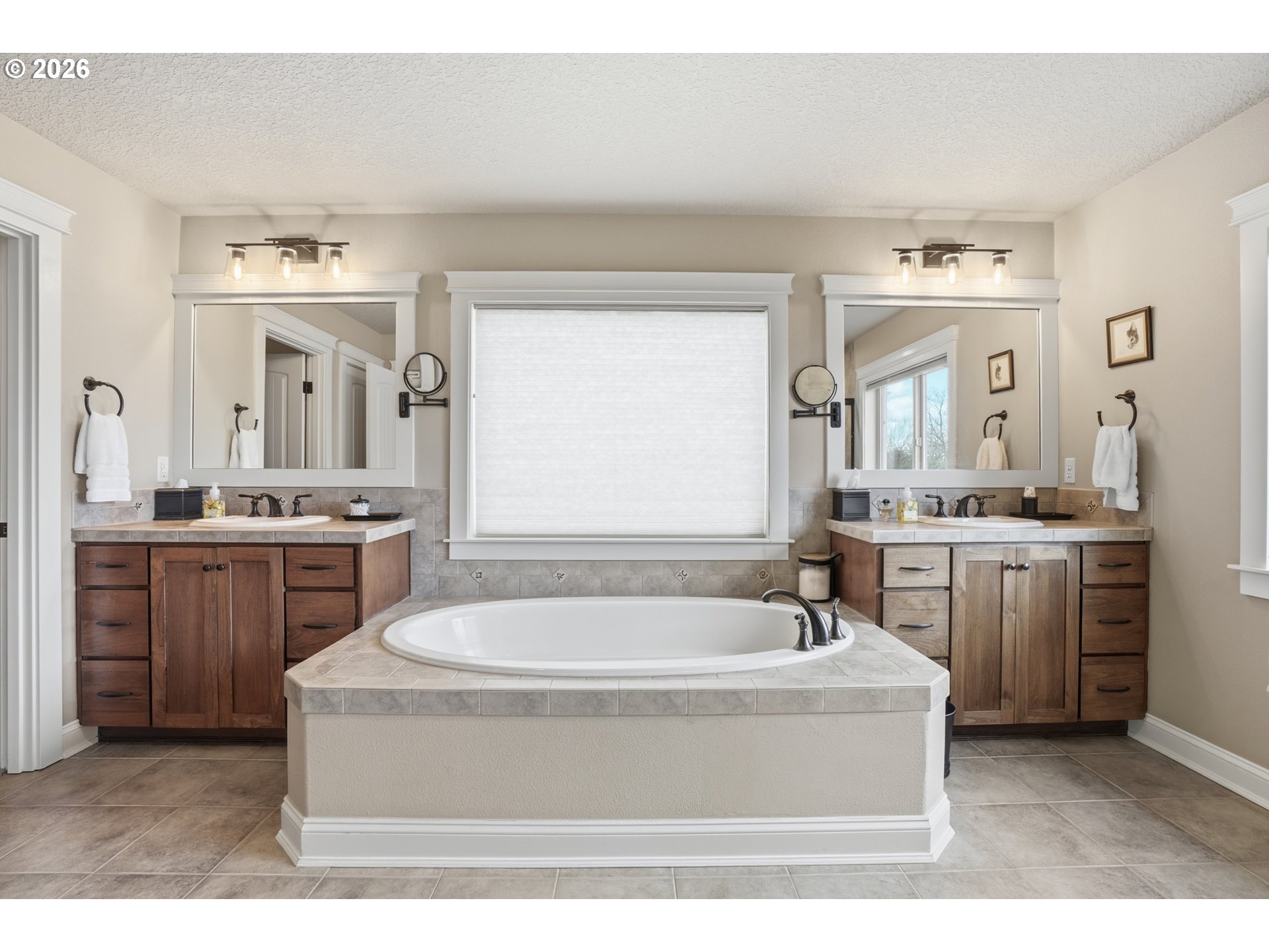 2552 Northwest 12th Circle Camas, WA 98607 - Photo 25 of 46 a spacious bathroom with a tub sink and mirror