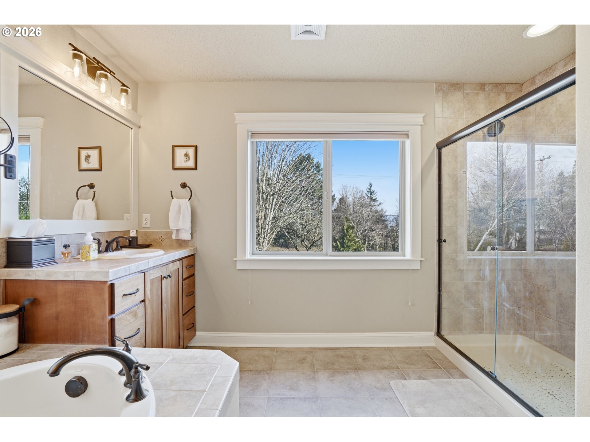 2552 Northwest 12th Circle Camas, WA 98607 - Photo 26 of 46 a bathroom with a tub sink and mirror