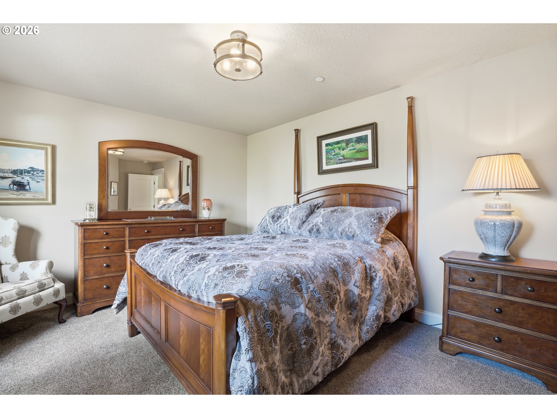 2552 Northwest 12th Circle Camas, WA 98607 - Photo 29 of 46 a bedroom with a bed and a lamp on dresser
