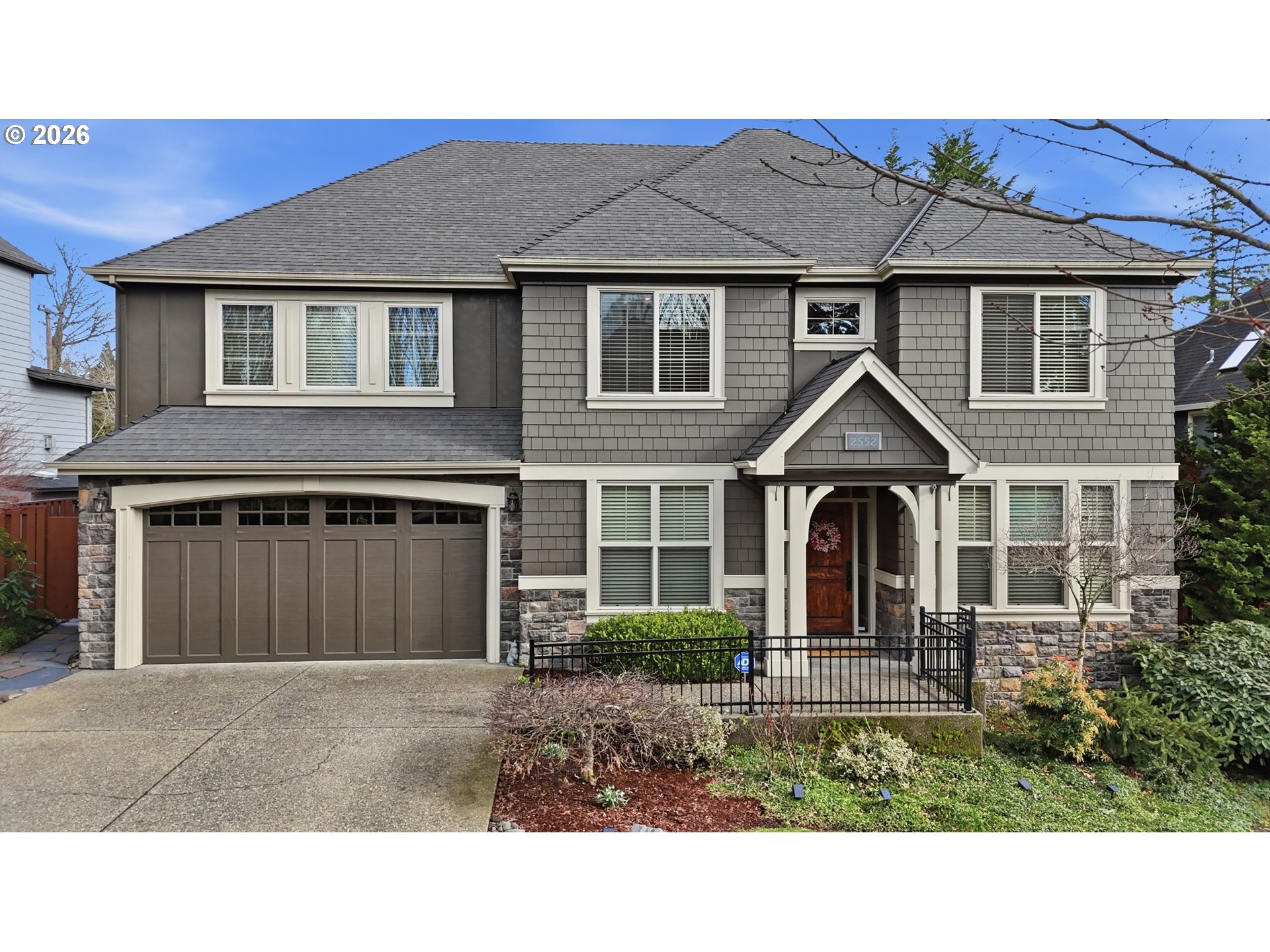2552 Northwest 12th Circle Camas, WA 98607 - Photo 42 of 46 a front view of a house with a yard and garage