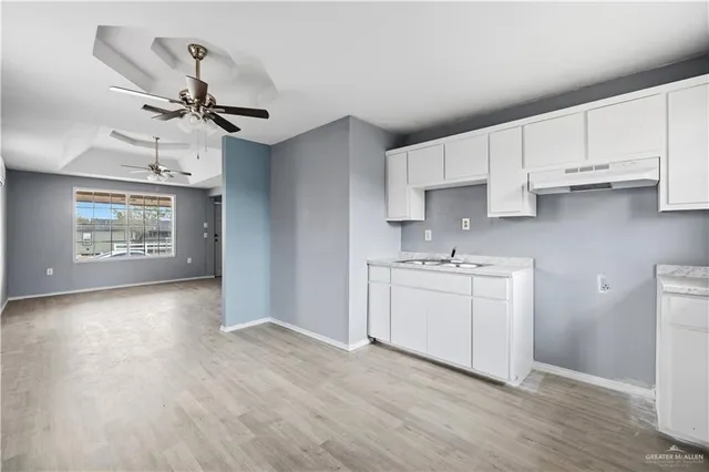 a view of a kitchen with electric appliances