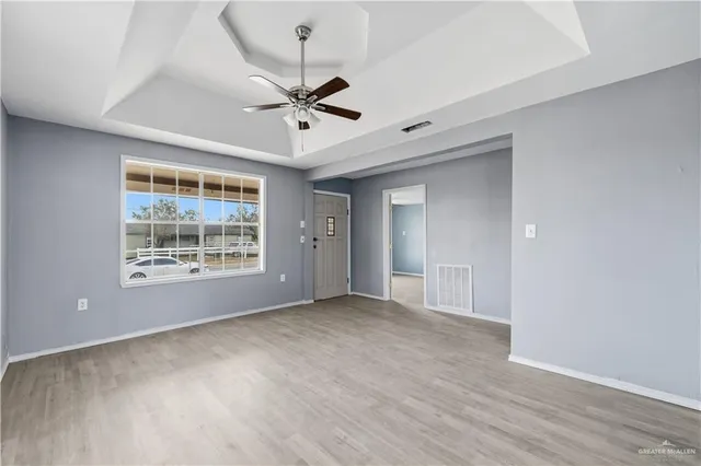 a view of an empty room with a window