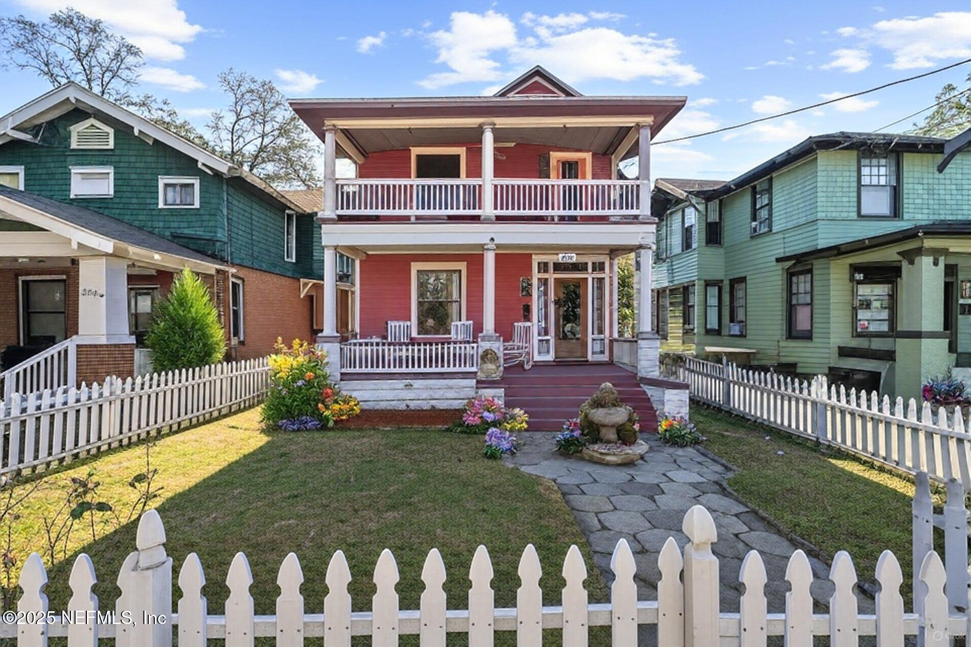 2230 Post Street Jacksonville, FL 32204 - Photo 2 of 48 a front view of a house with a garden