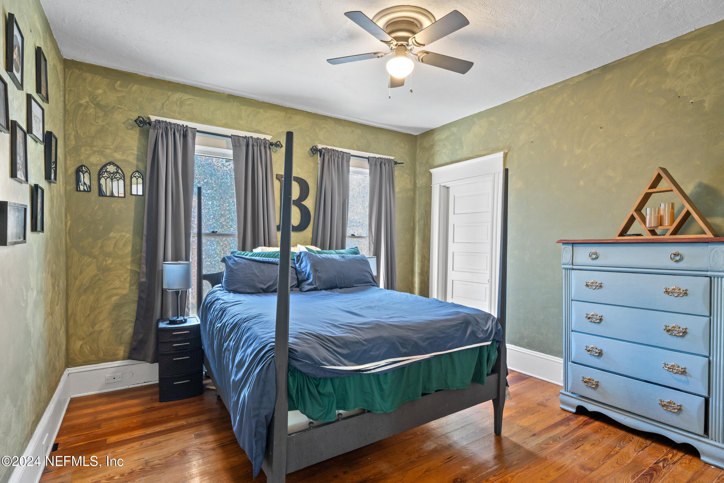 2230 Post Street Jacksonville, FL 32204 - Photo 34 of 48 a bedroom with a bed and a chandelier