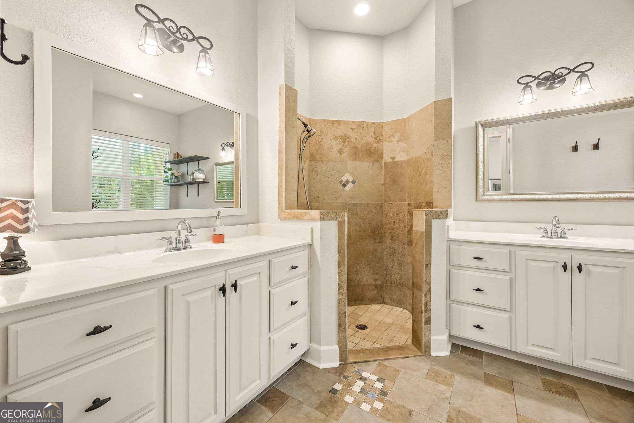 706 Hopewell Point Road White Oak, GA 31568 - Photo 33 of 84 The well-appointed primary bath offers dual vanities, extensive counter space, and a walk-in tiled shower designed for everyday luxury.
