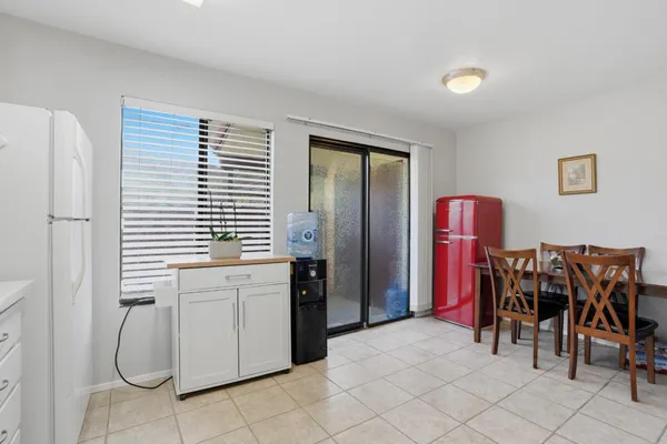 a kitchen with stainless steel appliances a stove a sink and a refrigerator
