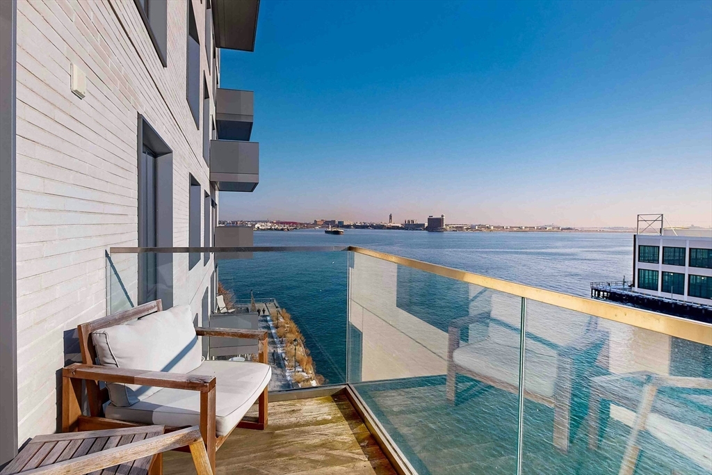 a view of balcony with furniture