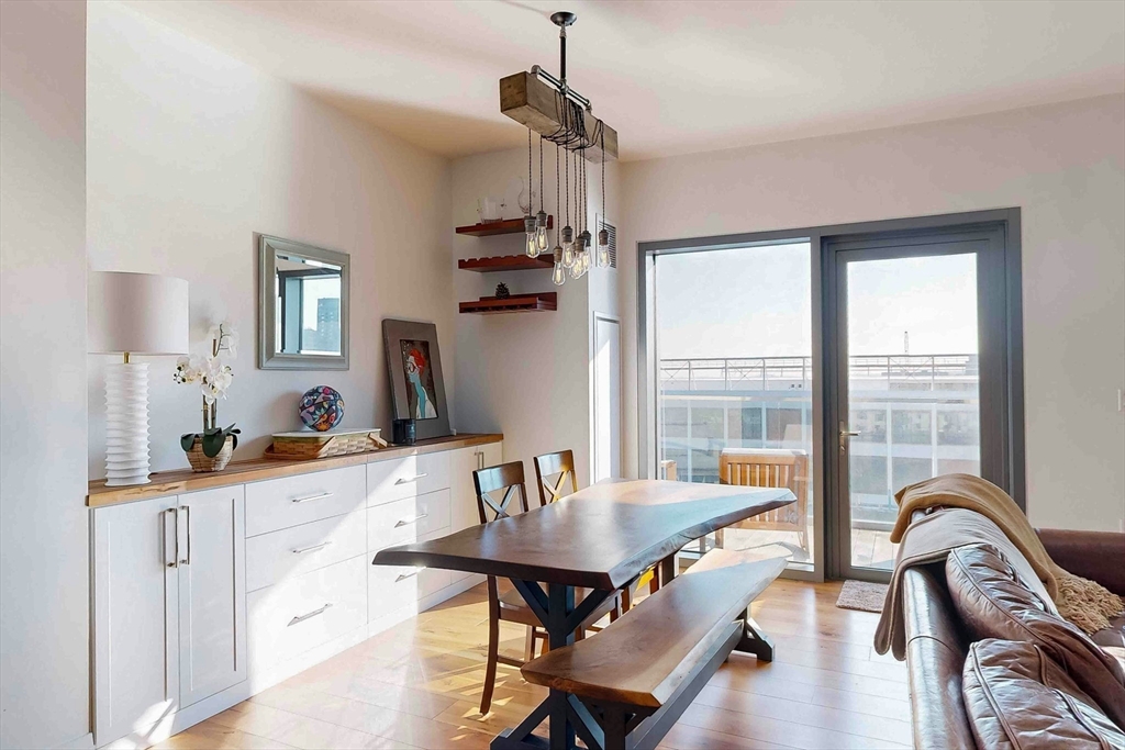 300 Pier 4 Blvd., Unit 6E Boston, MA 02210 - Photo 14 of 36 a view of a dining room with furniture window and outside view