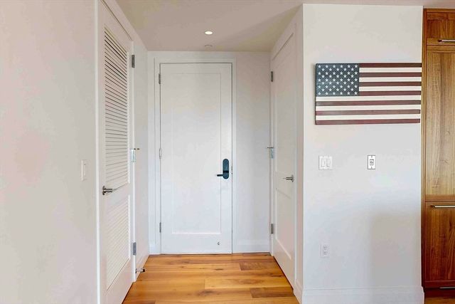 a bedroom with a large bed and a large window
