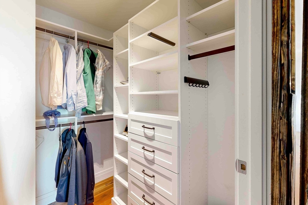 300 Pier 4 Blvd., Unit 6E Boston, MA 02210 - Photo 27 of 36 a view of walk in closet with clothes and shoes