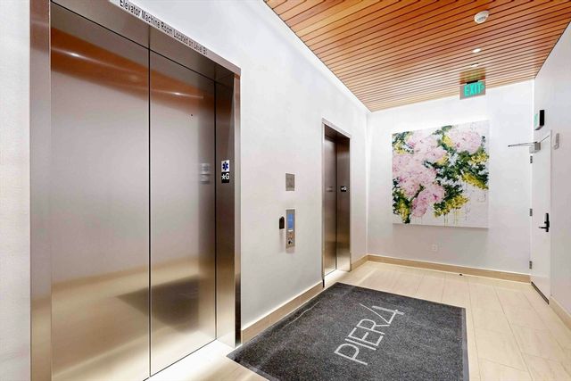 a living room with furniture a dining table and a window