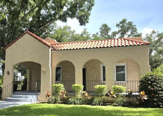 a front view of a house with garden