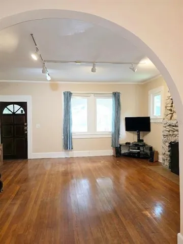 a view of a livingroom with a flat screen tv and a fireplace