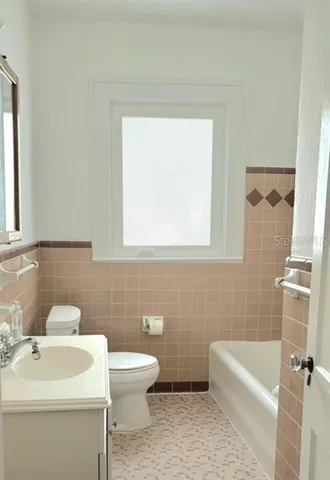 a bathroom with a sink a toilet and a bathtub