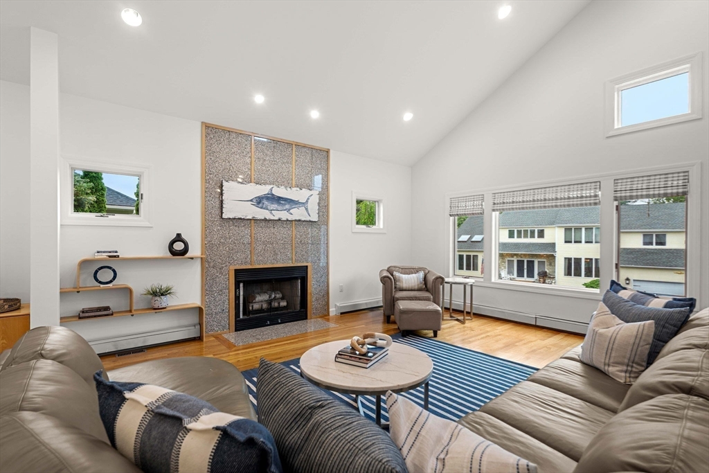 53 Gerald Road Marblehead, MA 01945 - Photo 2 of 42 a living room with furniture and a fireplace