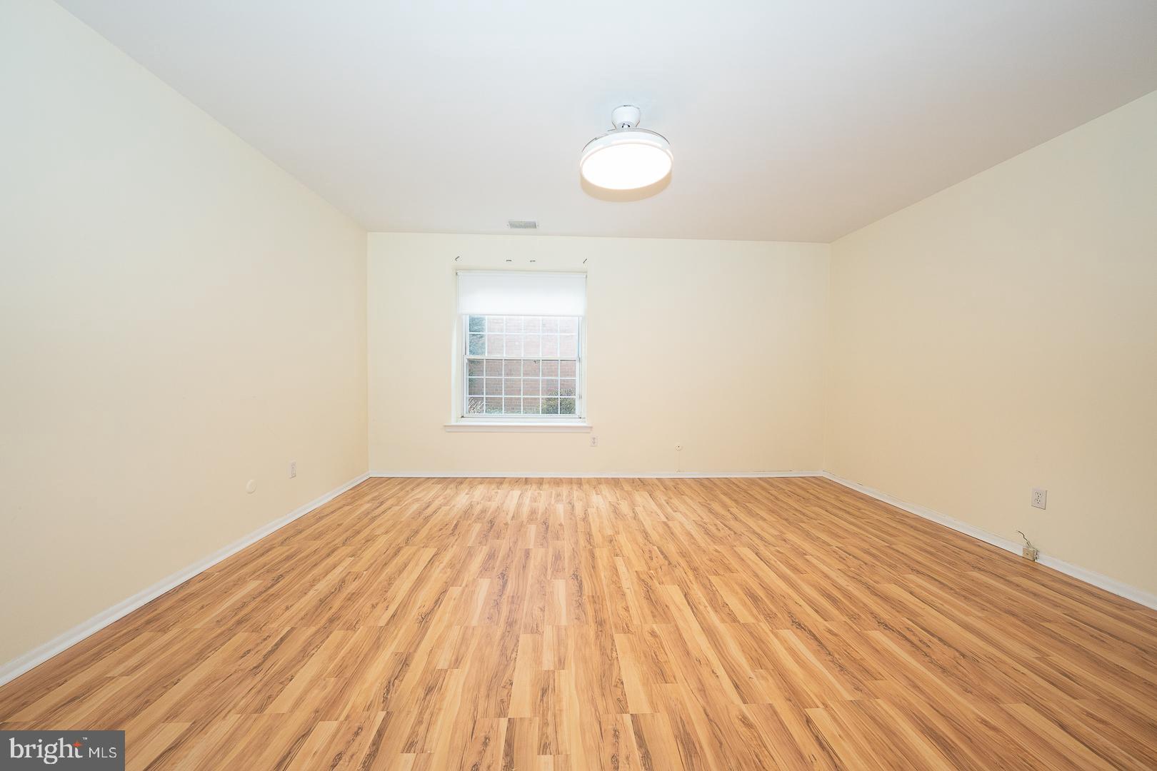 4000 Gypsy Lane, Unit 316A Philadelphia, PA 19129 - Photo 13 of 30 an empty room with wooden floor and windows