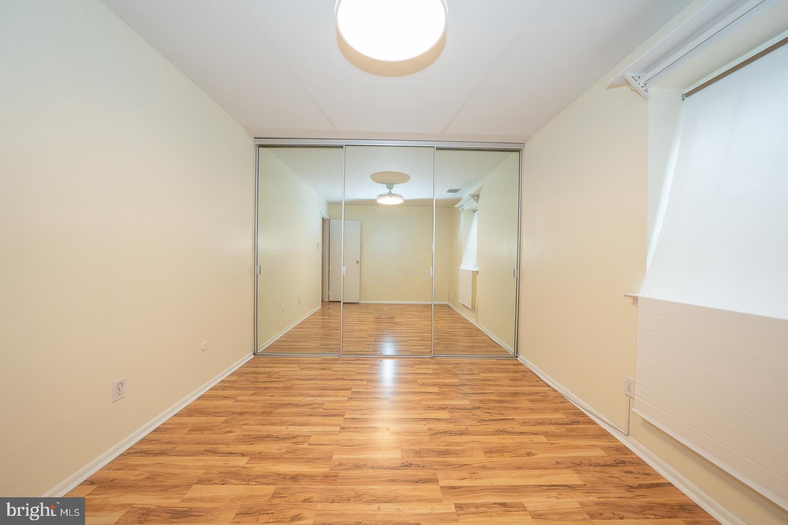 4000 Gypsy Lane, Unit 316A Philadelphia, PA 19129 - Photo 17 of 30 a view of a hallway with wooden floor