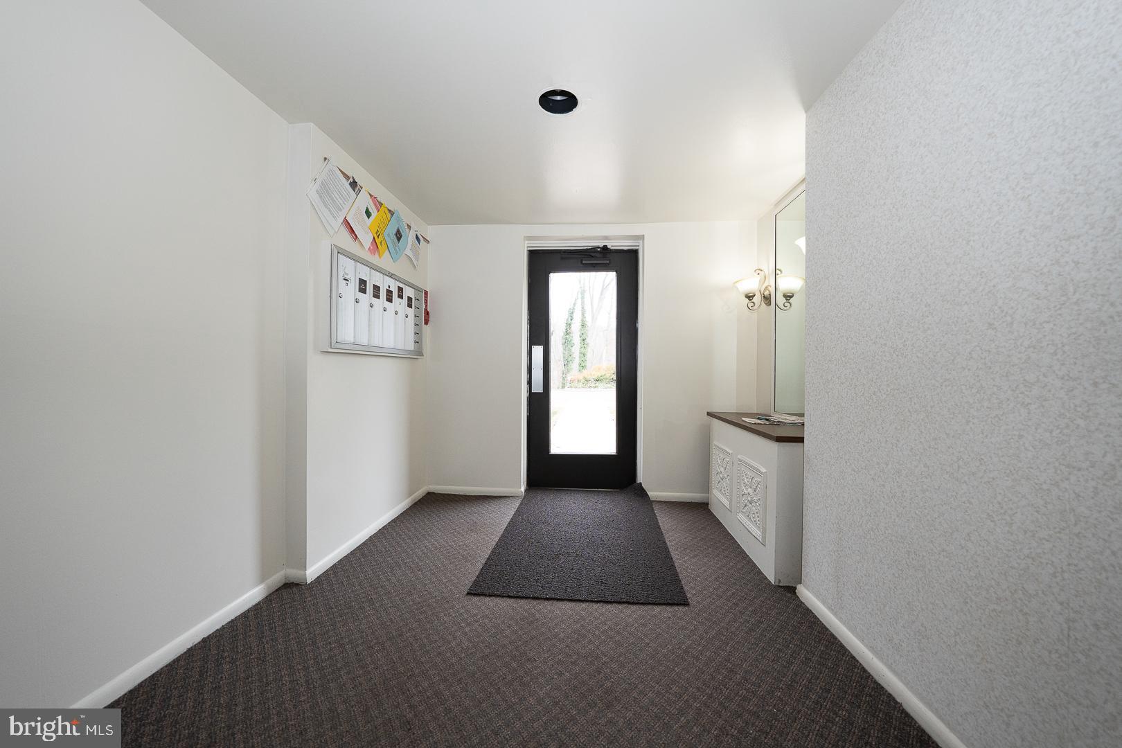4000 Gypsy Lane, Unit 316A Philadelphia, PA 19129 - Photo 20 of 30 a view of a hallway with wooden floor