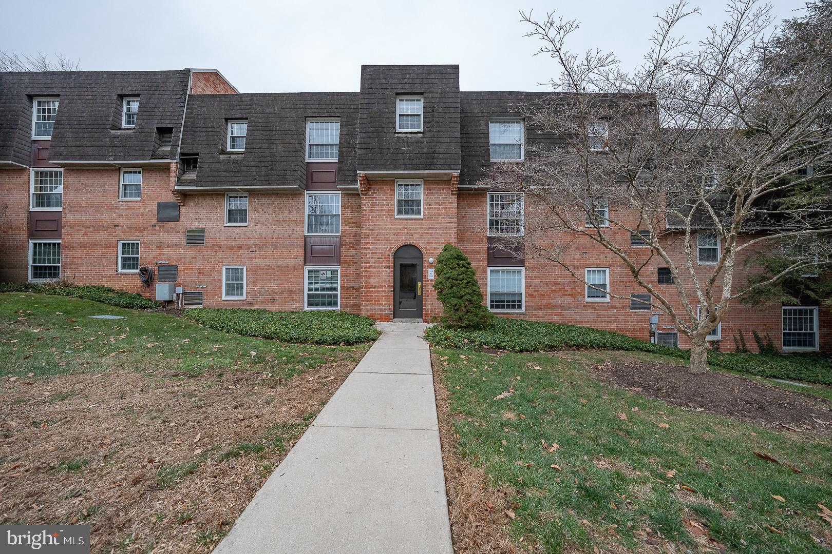 4000 Gypsy Lane, Unit 316A Philadelphia, PA 19129 - Photo 22 of 30 a front view of a house with garden