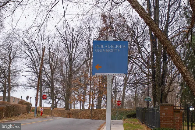 a sign on the side of a street