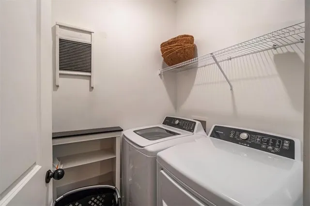 a bathroom with a granite countertop toilet sink and mirror