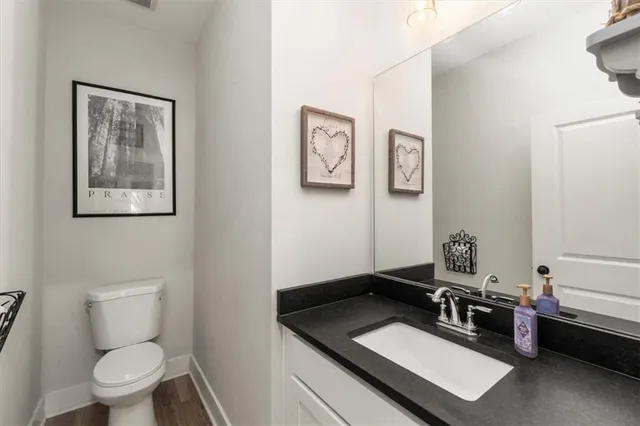 a bed room with a bed a television and a chandelier