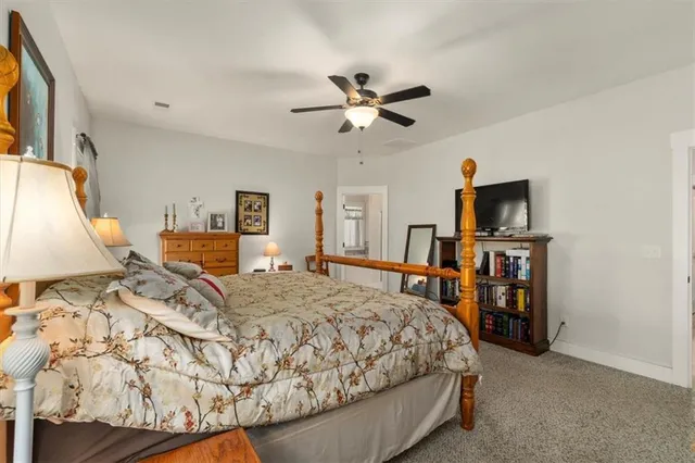 a bedroom with a bed and a couch