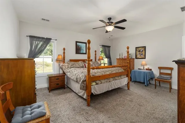 a bathroom with a bathtub and a window