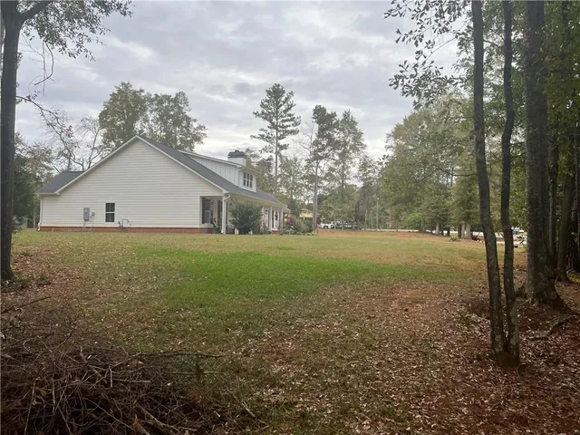 a house with trees in the background