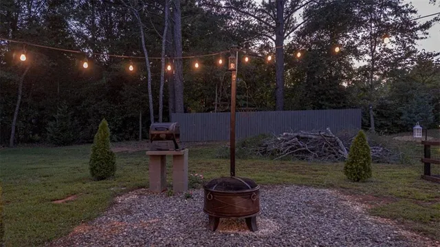 a view of front door of house with outdoor seating