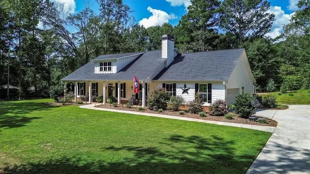 a view of a city with lush green forest