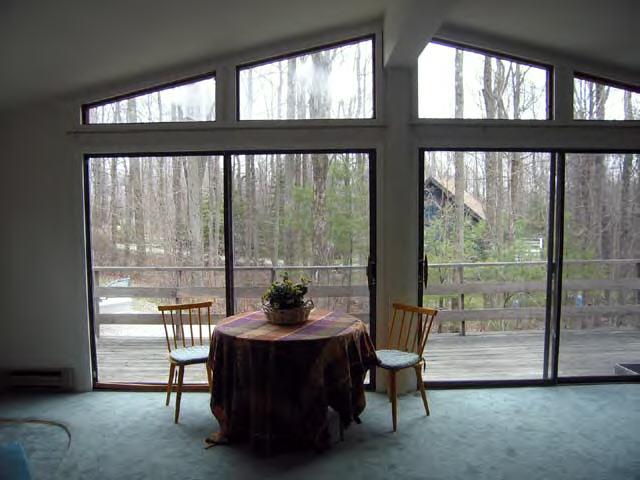 49 Stebbins Road Otis, MA 01253 - Photo 4 of 8 a view of a floor to ceiling window in an room