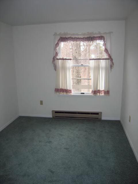 49 Stebbins Road Otis, MA 01253 - Photo 6 of 8 an empty room with a window