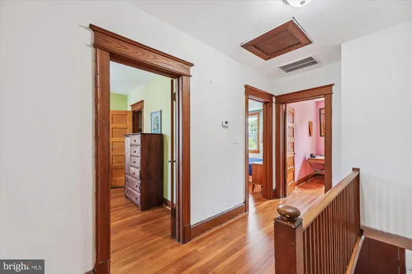 a view of an entryway with wooden floor