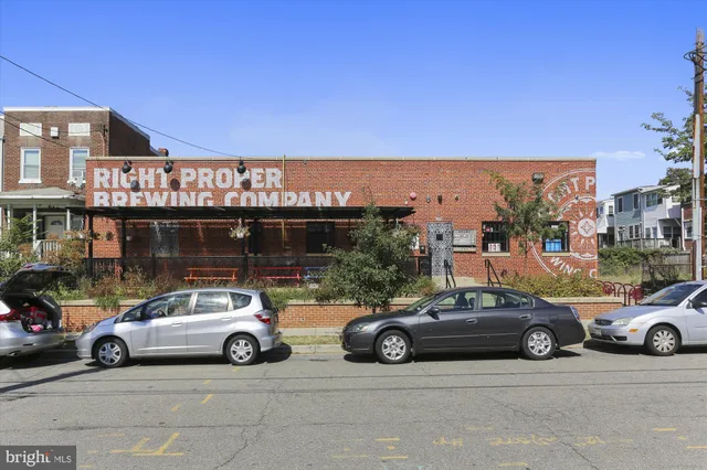 a view of a building with sitting area