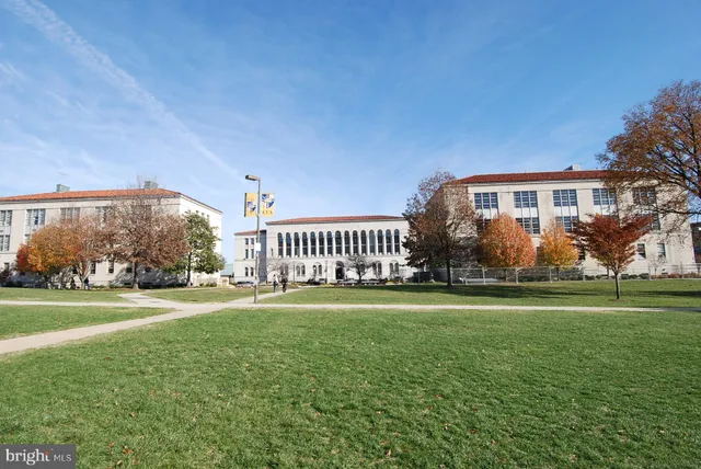a view of a building with sitting area