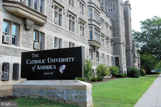 a view of a building with a street