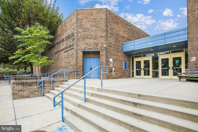 a front view of a building with garden
