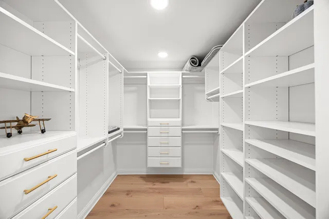 a kitchen with counter top space stainless steel appliances and cabinets