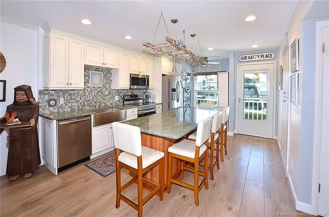 a view of a building with garden and sitting area