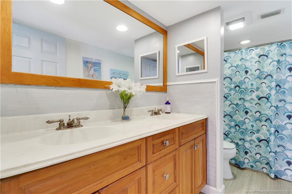 1864 Southwest Palm City Road, Unit 204 Stuart, FL 34994 - Photo 35 of 42 MAIN BATHROOM WITH DOUBLE SINKS IN UPDATED VANITY