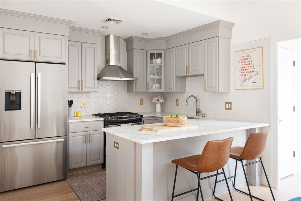 20 Mystic Street, Unit 2 Boston, MA 02129 - Photo 2 of 15 a kitchen with a stove a refrigerator and a sink