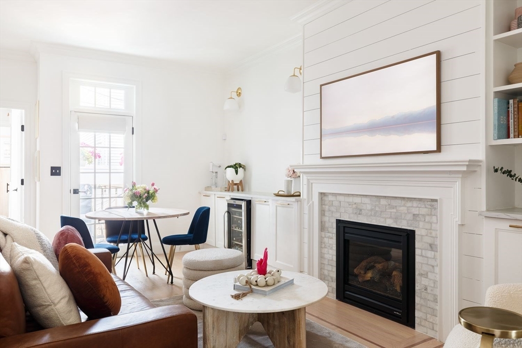 20 Mystic Street, Unit 2 Boston, MA 02129 - Photo 5 of 15 a living room with furniture a table and a fireplace