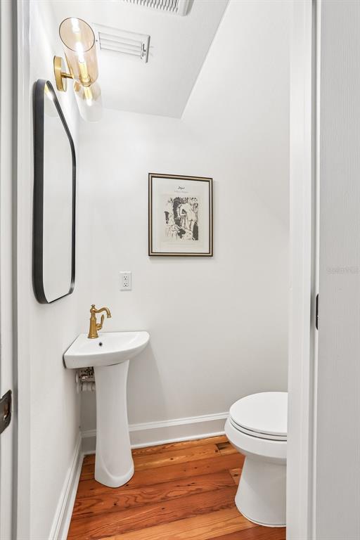 1012 Morfield Lane Brandon, FL 33511 - Photo 58 of 100 a white toilet sitting next to a bathroom sink
