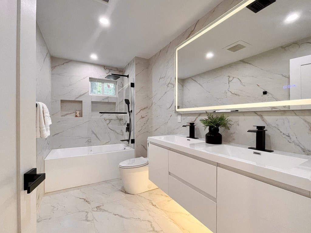 17 Gayland Road Needham, MA 02492 - Photo 15 of 33 a bathroom with a sink a toilet and bathtub