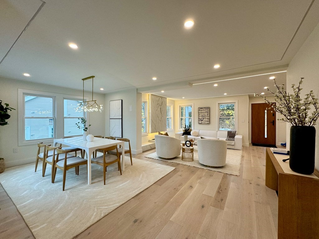 17 Gayland Road Needham, MA 02492 - Photo 2 of 33 a living room with furniture a dining table and kitchen view