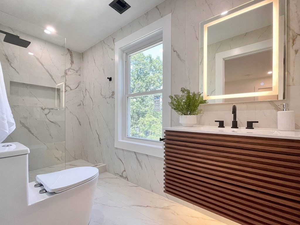 17 Gayland Road Needham, MA 02492 - Photo 24 of 33 a bathroom with a sink a toilet a window and shower