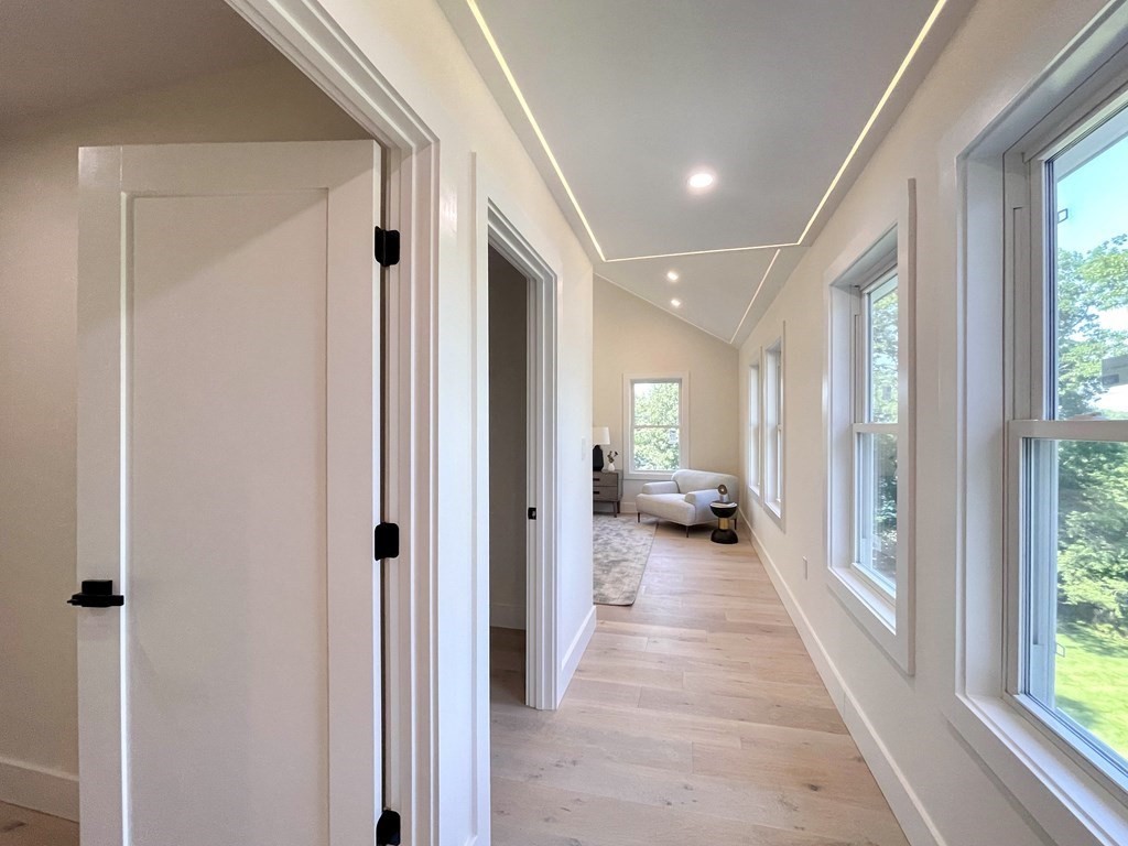 17 Gayland Road Needham, MA 02492 - Photo 9 of 33 a view of a hallway with a livingroom and furniture